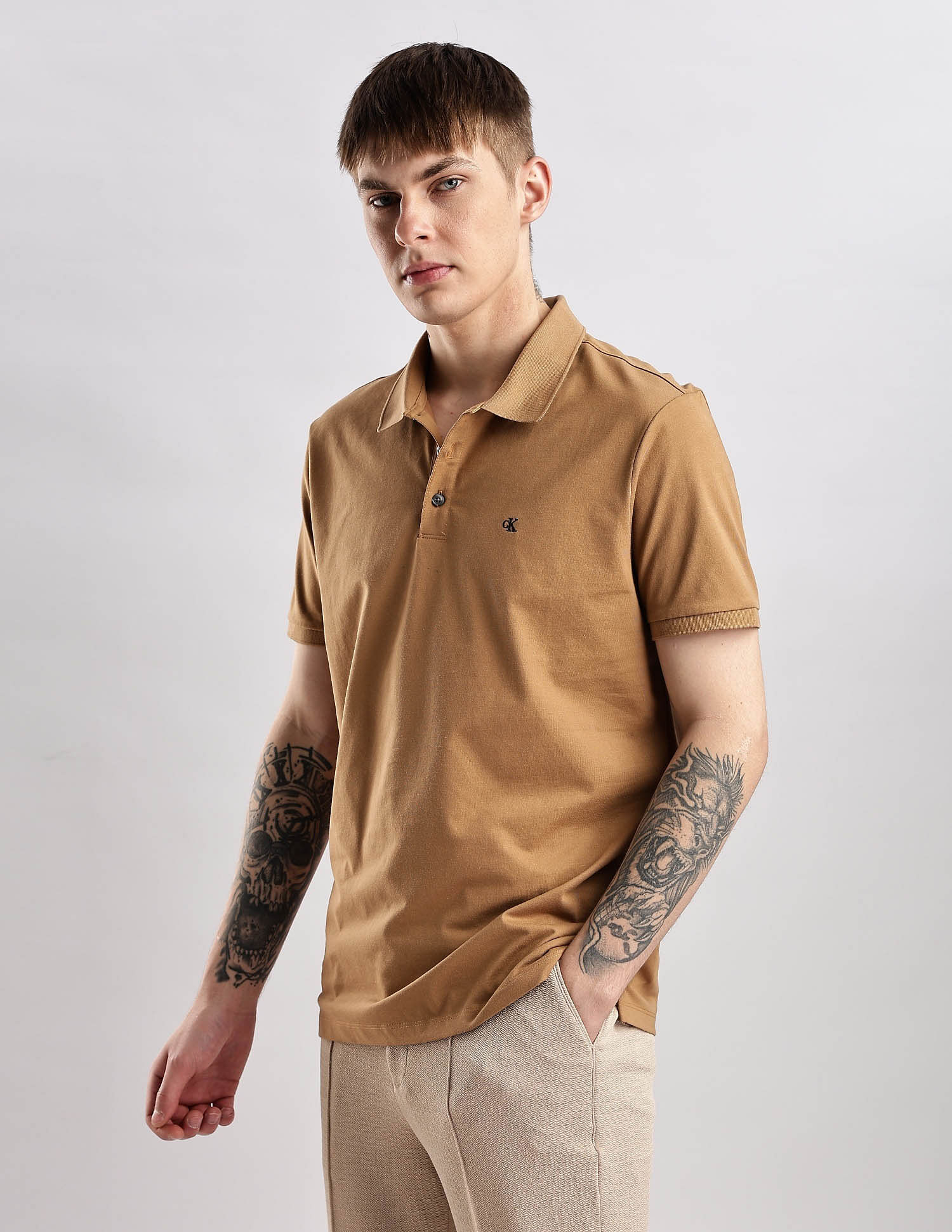 Calvin Klein Jeans Mens Brown Solid Polo Shirts