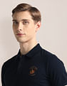 U.S. Polo Assn. Ribbed Collar Solid Polo Shirt